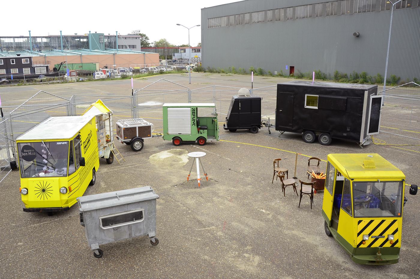 A row of mobile units and trailers on a lot