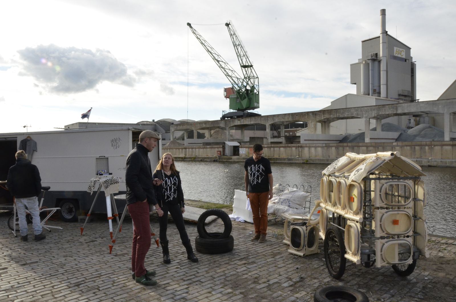 The finished house standing at the quay under the cranes